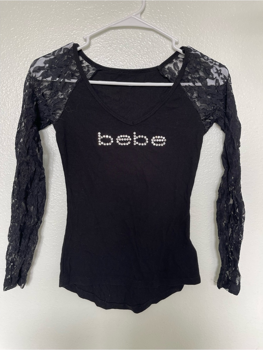 bebe Black Ribbed Top with Lace Sleeves and Crystal Logo